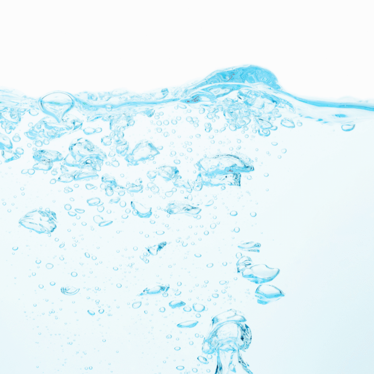 Esta imagen muestra un fondo azul claro con burbujas flotantes